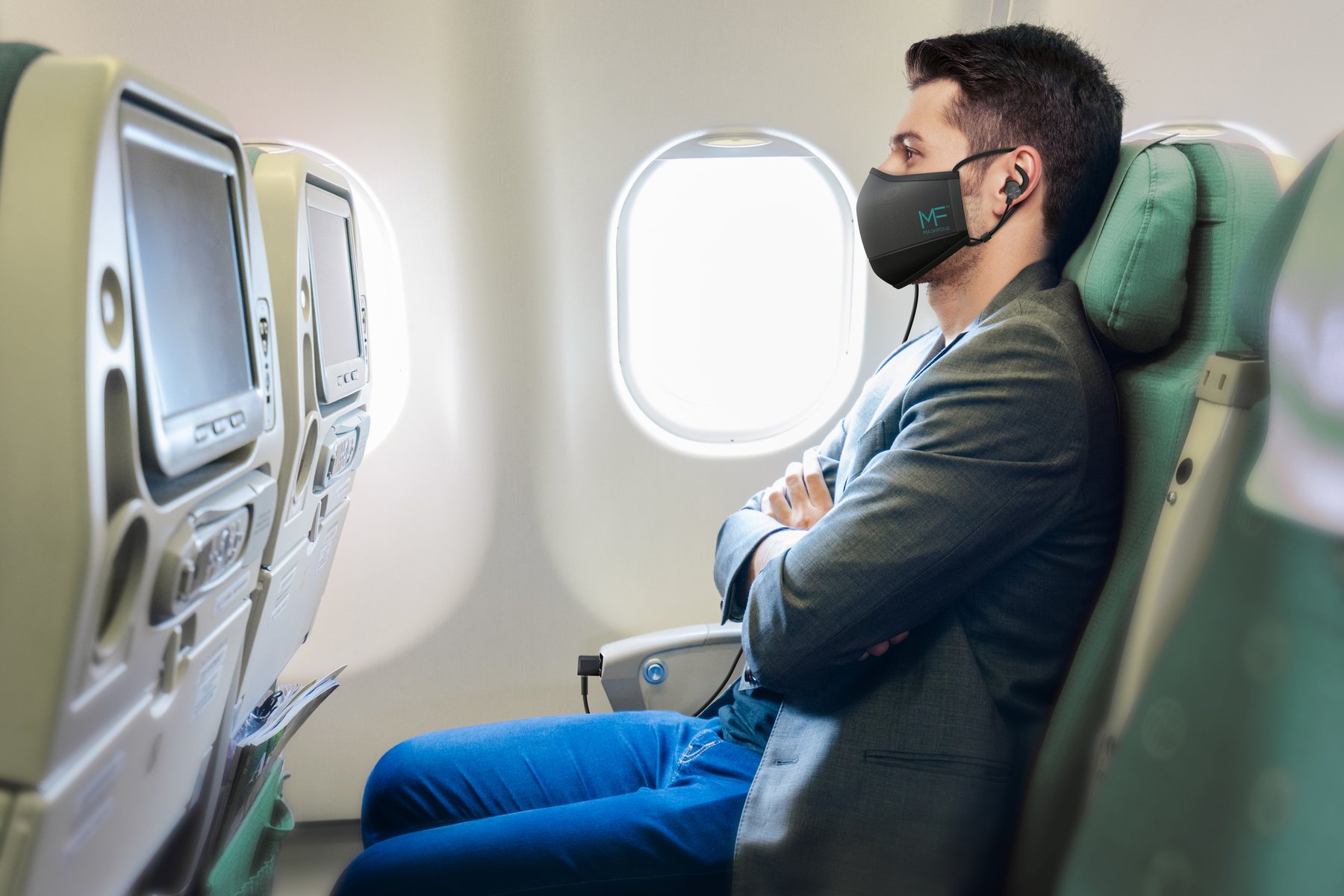 Passenger wearing MaskFone on an airplane
